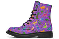 Purple boots with a pattern of different coloured cute baby dinosaurs, prehistoric-looking trees and dinosaur eggs