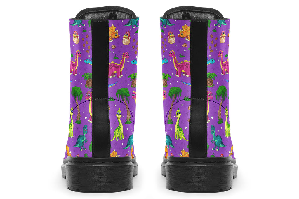 Purple boots with a pattern of different coloured cute baby dinosaurs, prehistoric-looking trees and dinosaur eggs