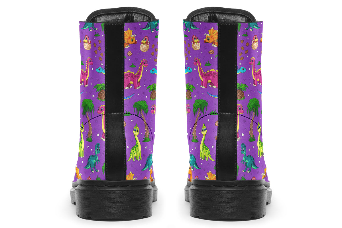 Purple boots with a pattern of different coloured cute baby dinosaurs, prehistoric-looking trees and dinosaur eggs