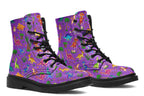Purple boots with a pattern of different coloured cute baby dinosaurs, prehistoric-looking trees and dinosaur eggs