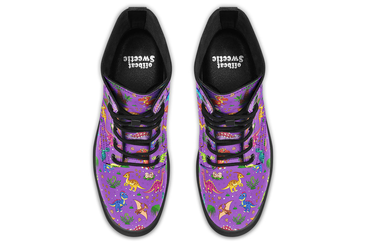 Purple boots with a pattern of different coloured cute baby dinosaurs, prehistoric-looking trees and dinosaur eggs