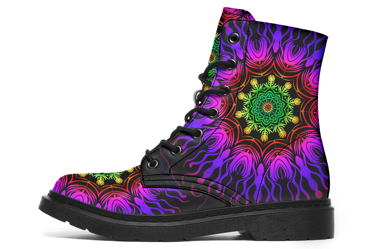 Boots featuring a vibrant, almost neon mandala pattern in a gradient of green, yellow, red, pink and purple on a black background.