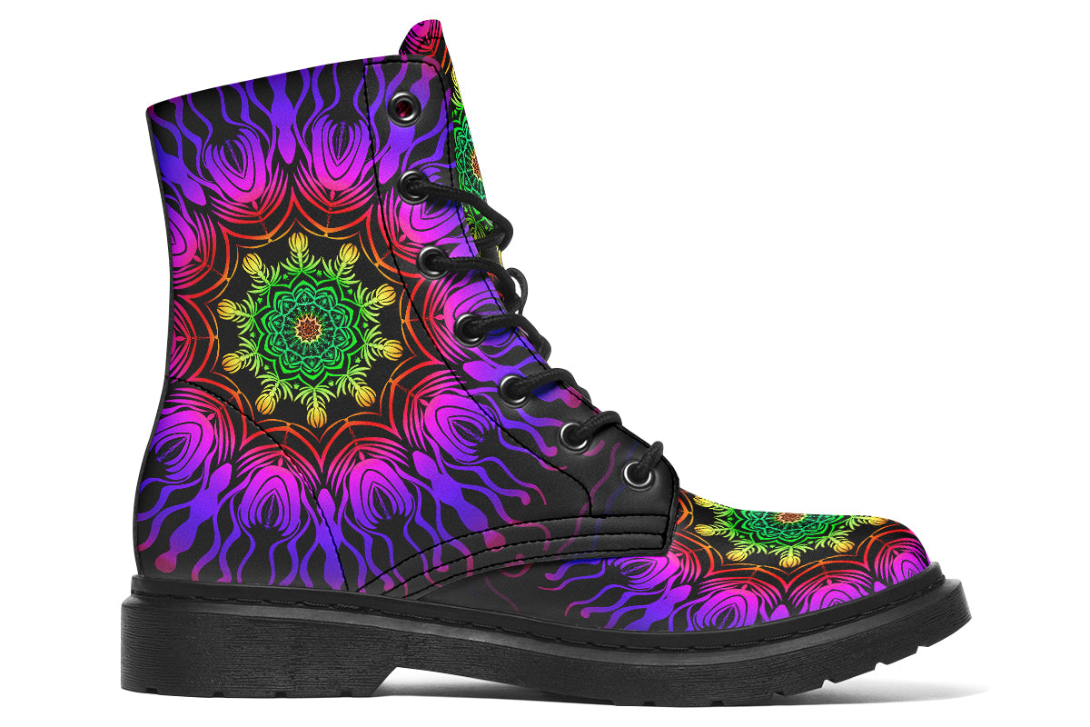 Boots featuring a vibrant, almost neon mandala pattern in a gradient of green, yellow, red, pink and purple on a black background.