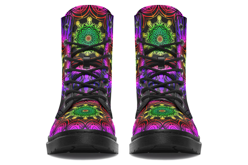 Boots featuring a vibrant, almost neon mandala pattern in a gradient of green, yellow, red, pink and purple on a black background.