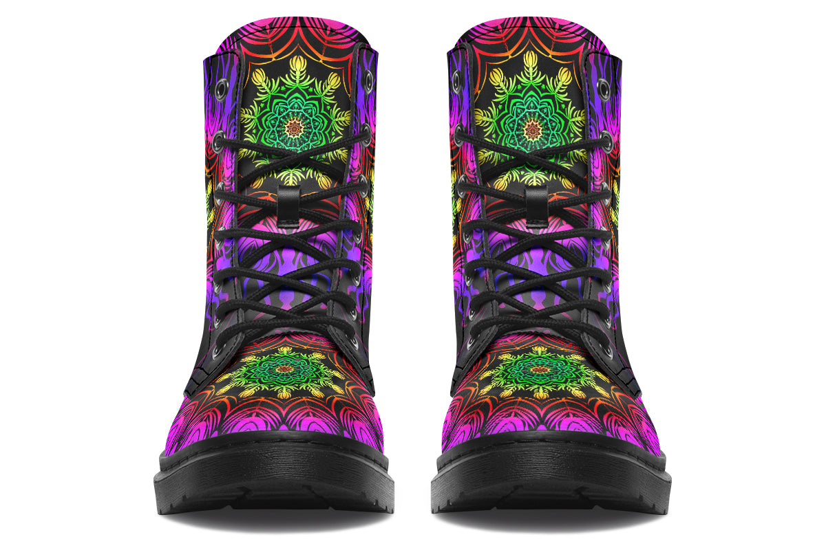 Boots featuring a vibrant, almost neon mandala pattern in a gradient of green, yellow, red, pink and purple on a black background.
