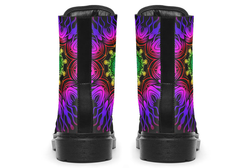 Boots featuring a vibrant, almost neon mandala pattern in a gradient of green, yellow, red, pink and purple on a black background.