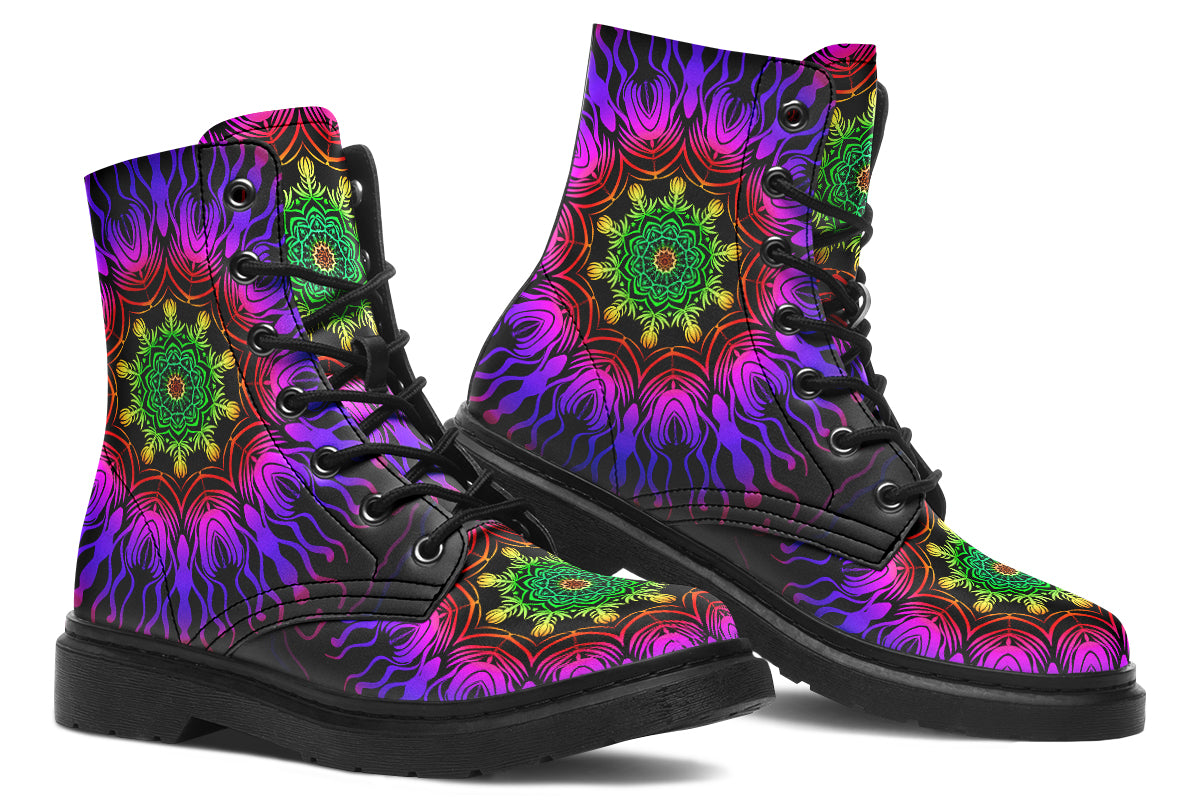 Boots featuring a vibrant, almost neon mandala pattern in a gradient of green, yellow, red, pink and purple on a black background.