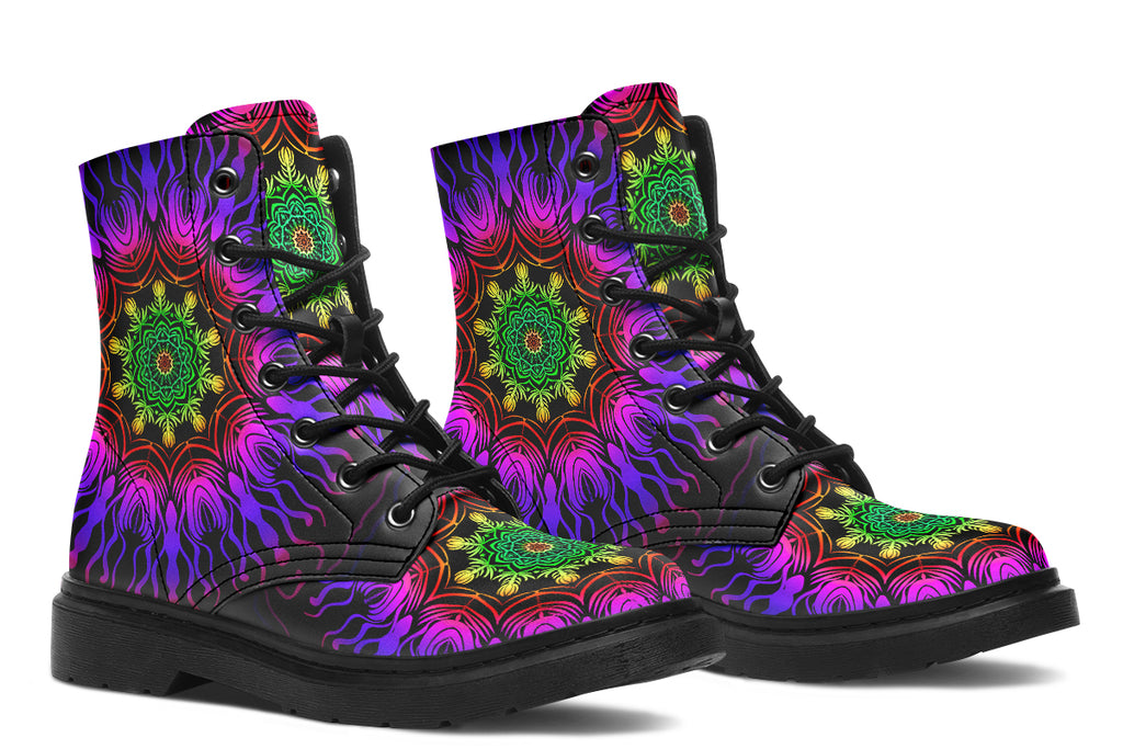 Boots featuring a vibrant, almost neon mandala pattern in a gradient of green, yellow, red, pink and purple on a black background.