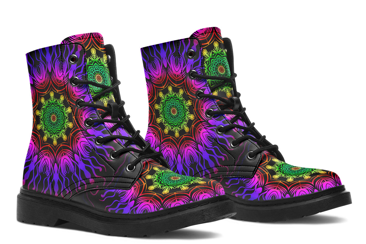 Boots featuring a vibrant, almost neon mandala pattern in a gradient of green, yellow, red, pink and purple on a black background.
