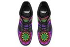 Boots featuring a vibrant, almost neon mandala pattern in a gradient of green, yellow, red, pink and purple on a black background.