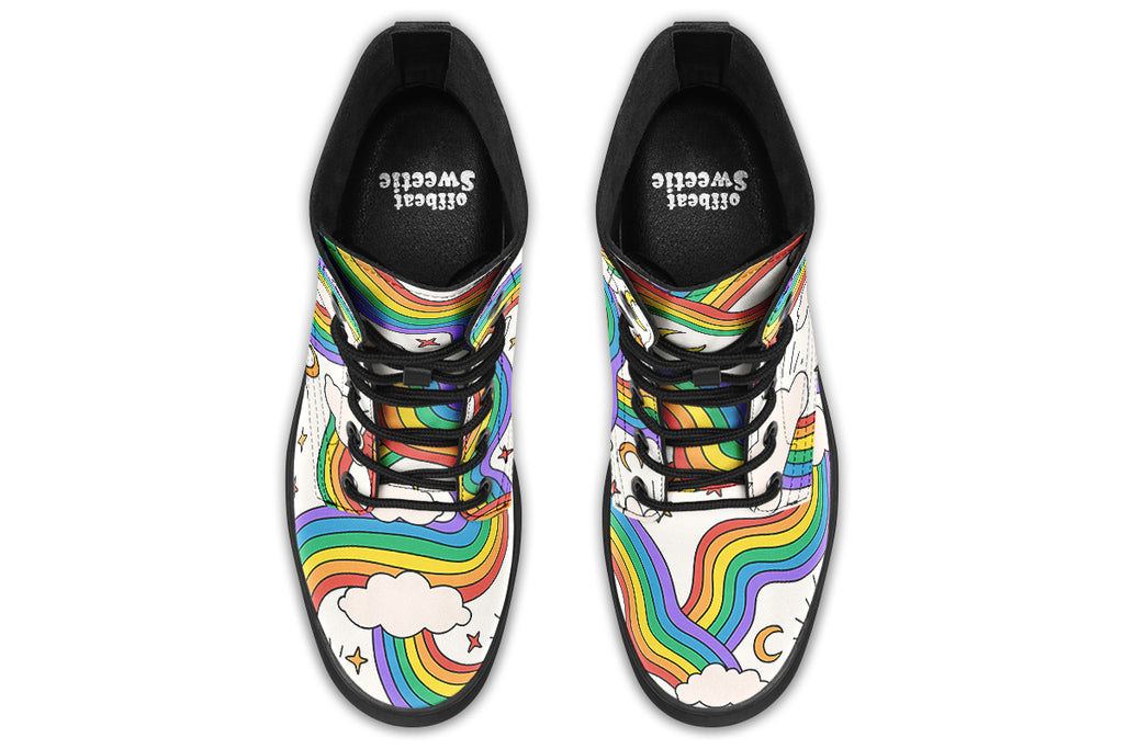 White boots with a pattern of rainbows and clouds