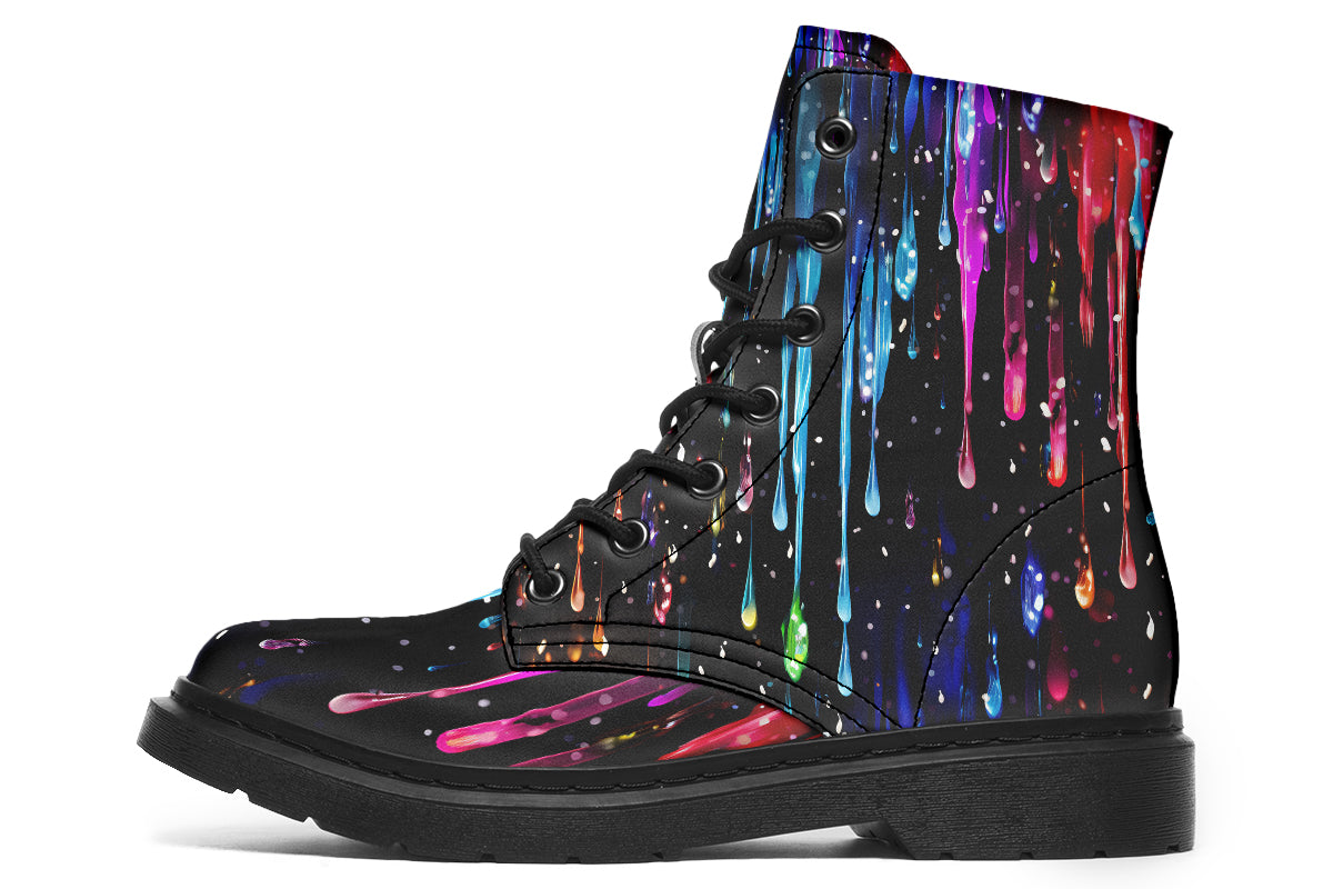 Black boots with a design that looks like different coloured paints dripping down the boots