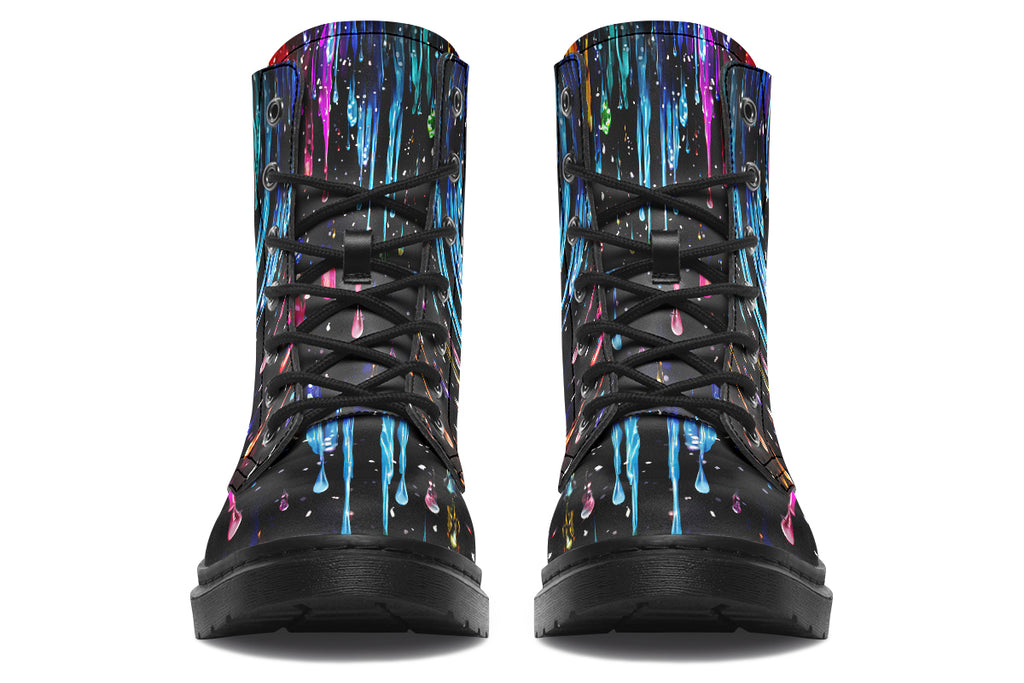 Black boots with a design that looks like different coloured paints dripping down the boots