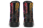 Black boots with a design that looks like different coloured paints dripping down the boots