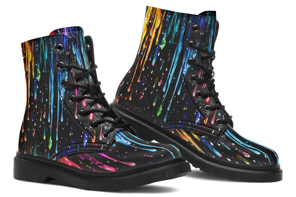 Black boots with a design that looks like different coloured paints dripping down the boots