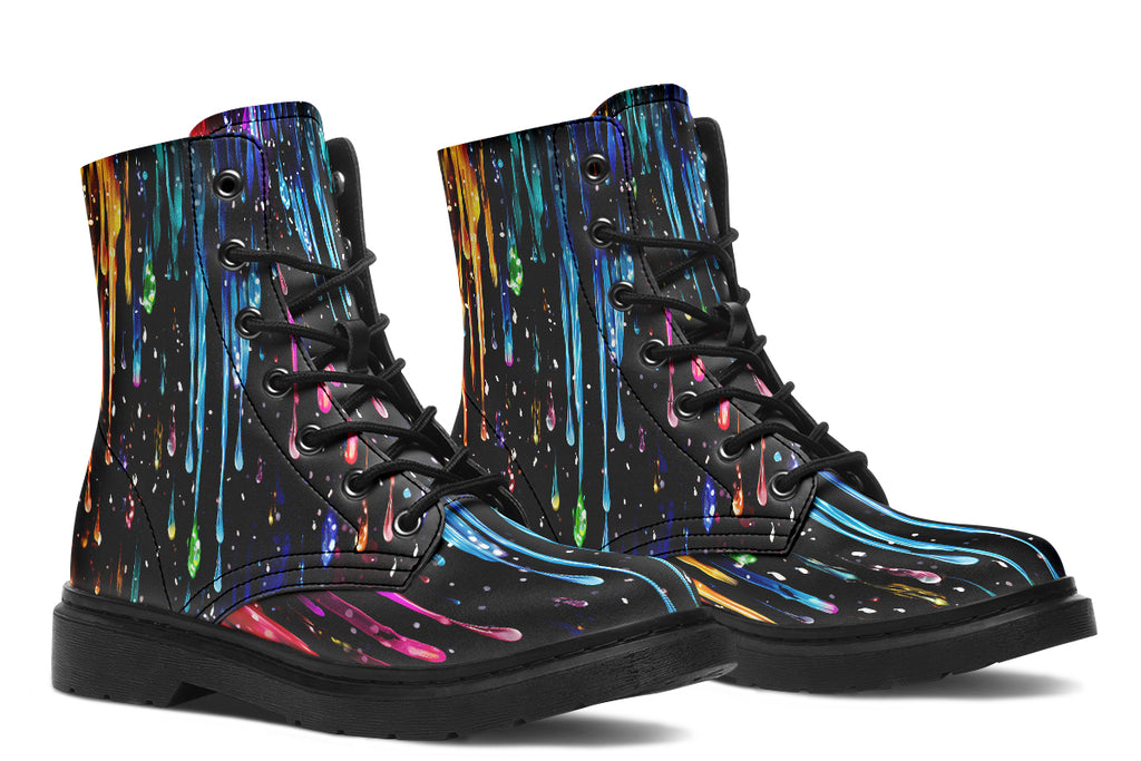 Black boots with a design that looks like different coloured paints dripping down the boots