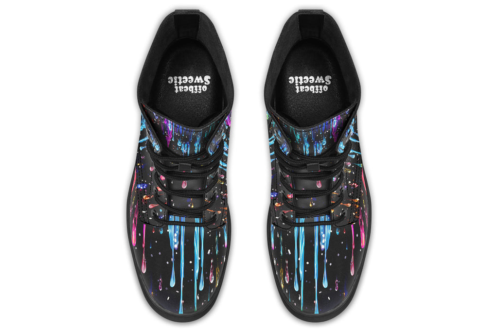 Black boots with a design that looks like different coloured paints dripping down the boots