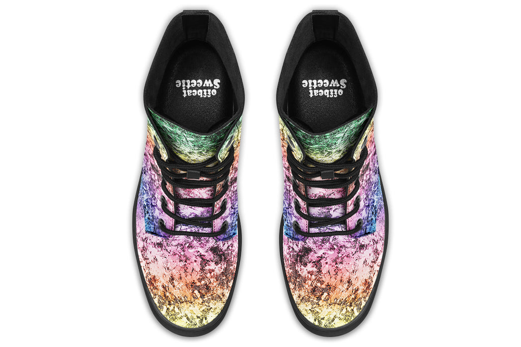 Boots featuring a pastel rainbow gradient pattern with a dark textured overlay to give it a grunge, aged look.