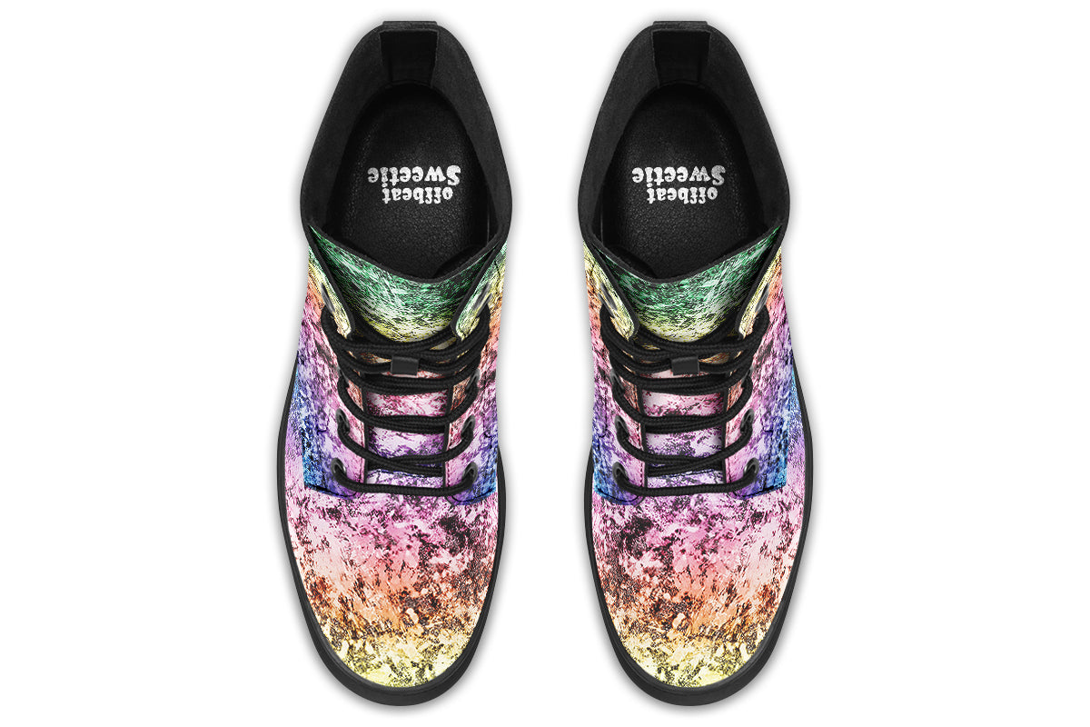 Boots featuring a pastel rainbow gradient pattern with a dark textured overlay to give it a grunge, aged look.