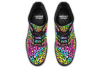 Boots featuring a colourful leopard print over a rainbow coloured background.