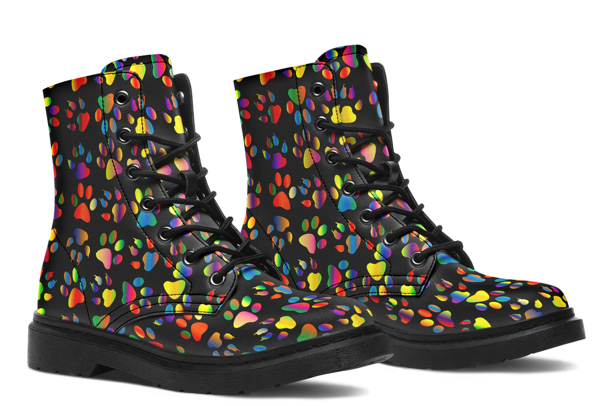 Black boots featuring a rainbow gradient paw print pattern