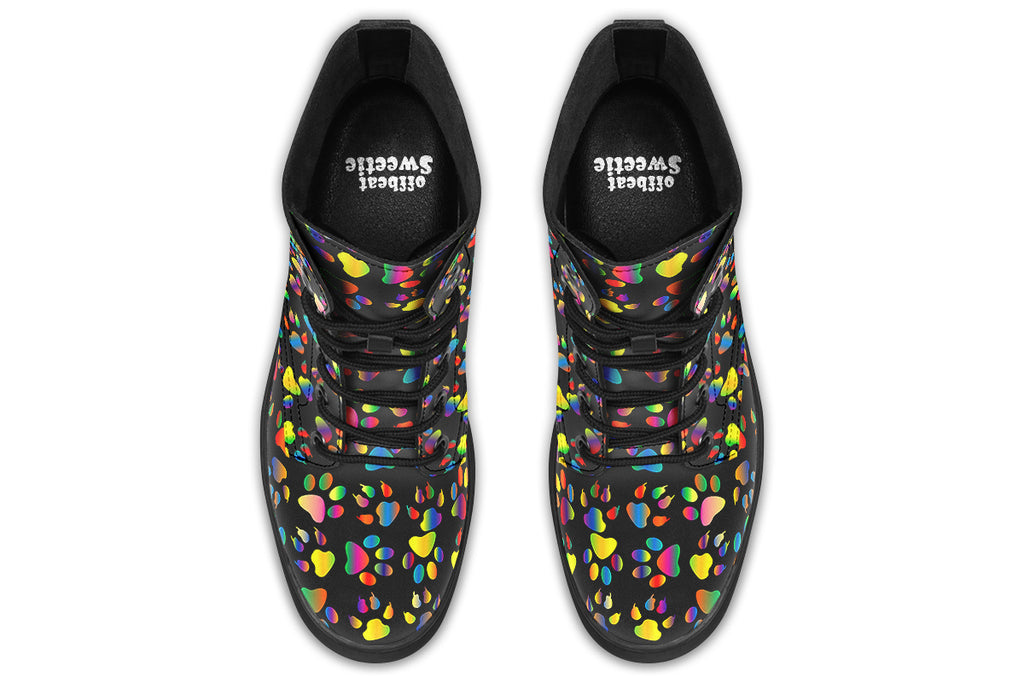 Black boots featuring a rainbow gradient paw print pattern