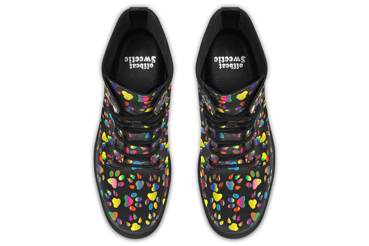 Black boots featuring a rainbow gradient paw print pattern