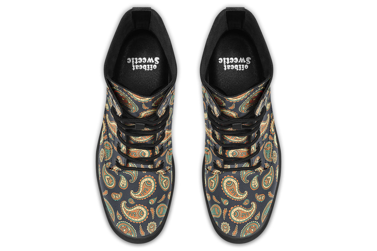 Deep navy blue boots with a paisley pattern in browns, greens and creams