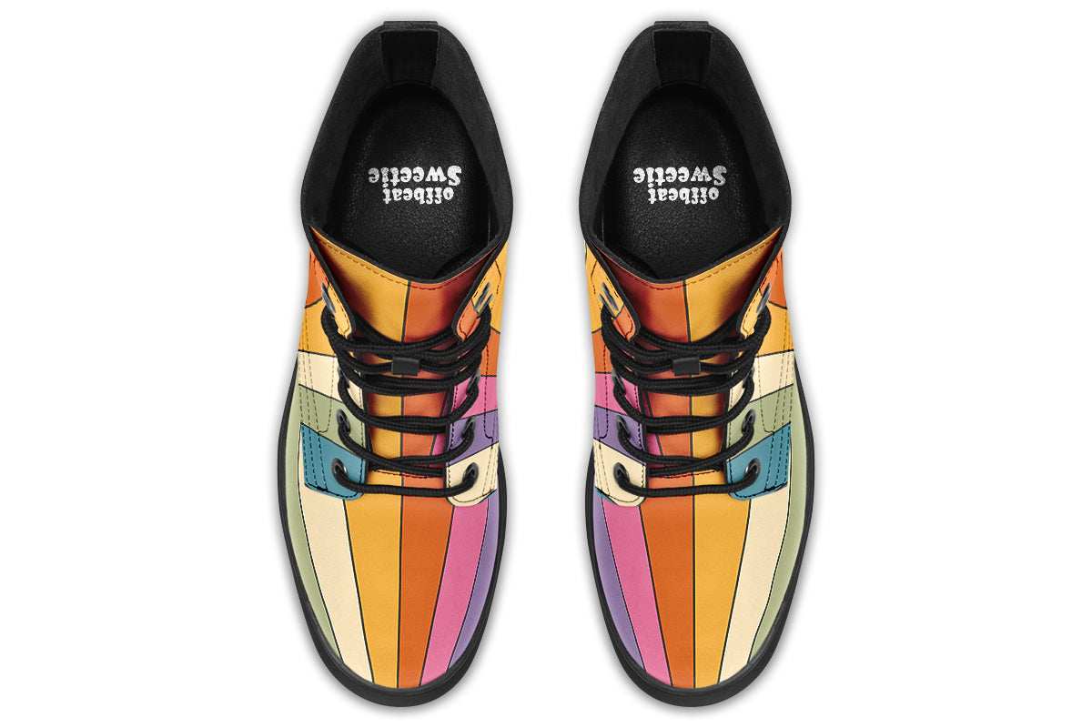 Boots featuring a vertical rainbow design in retro-themed colours, such as mustard yellow, burnt orange, olive green etc. 