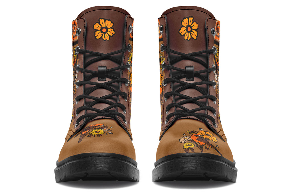 Tan brown boots with a rosella and floral design in retro colours of oranges, mustard yellows and browns. It features a patchwork pattern across the top of the boots.