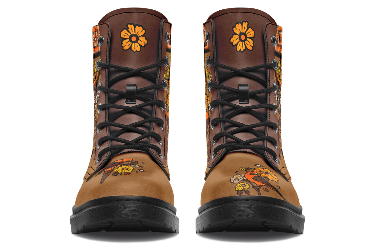 Tan brown boots with a rosella and floral design in retro colours of oranges, mustard yellows and browns. It features a patchwork pattern across the top of the boots.