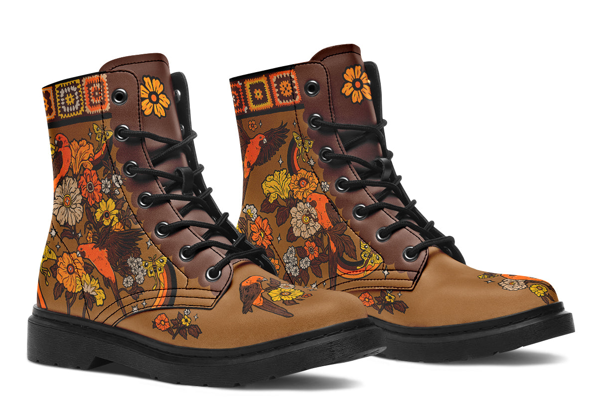 Tan brown boots with a rosella and floral design in retro colours of oranges, mustard yellows and browns. It features a patchwork pattern across the top of the boots.