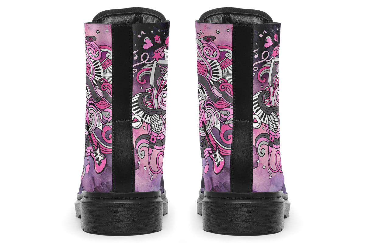 Purple and pink music-themed patterned boot with black sole. Design shows musical instruments, treble clefs, sheet music etc amongst decorative swirls.