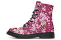 Boots featuring a pink and white floral pattern on a dark reddish pink background