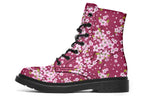 Boots featuring a pink and white floral pattern on a dark reddish pink background