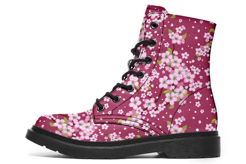 Boots featuring a pink and white floral pattern on a dark reddish pink background