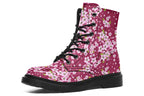 Boots featuring a pink and white floral pattern on a dark reddish pink background