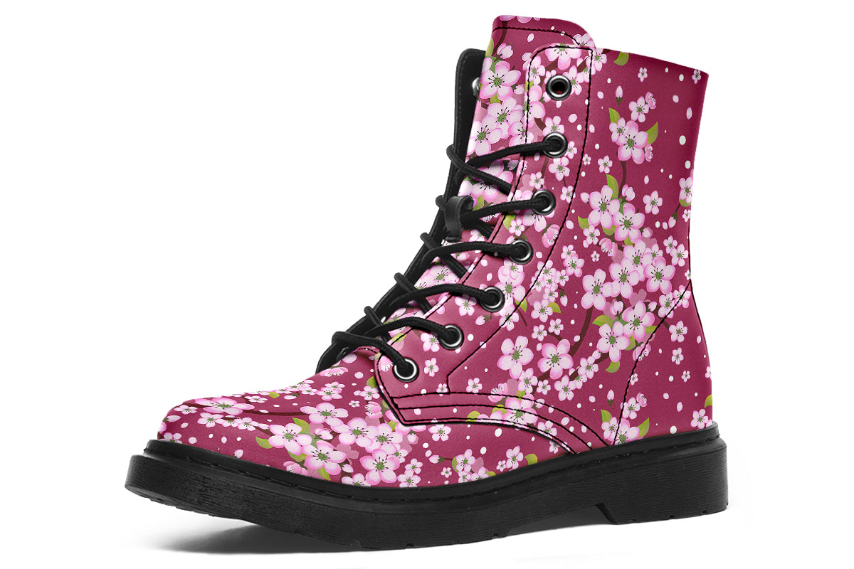 Boots featuring a pink and white floral pattern on a dark reddish pink background