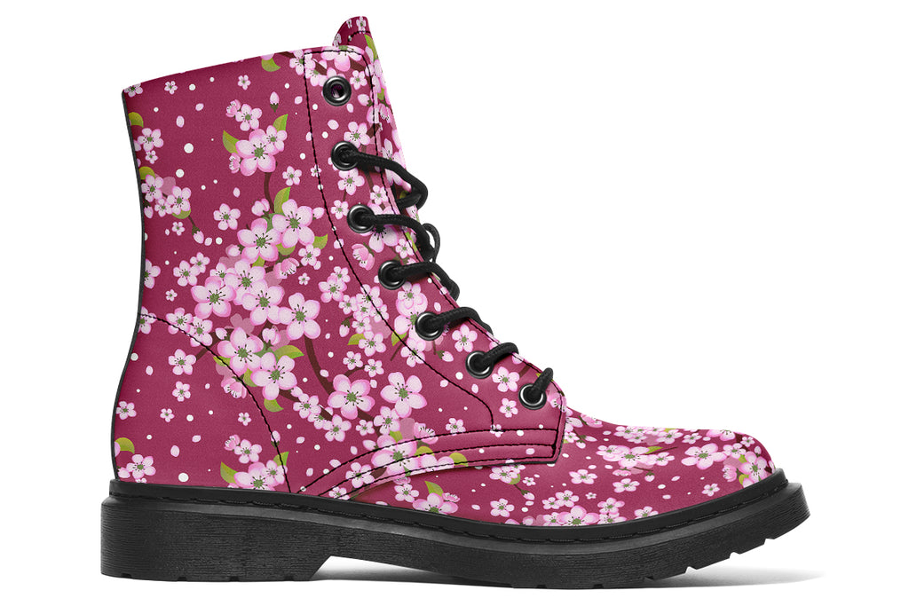 Boots featuring a pink and white floral pattern on a dark reddish pink background
