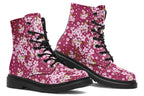 Boots featuring a pink and white floral pattern on a dark reddish pink background