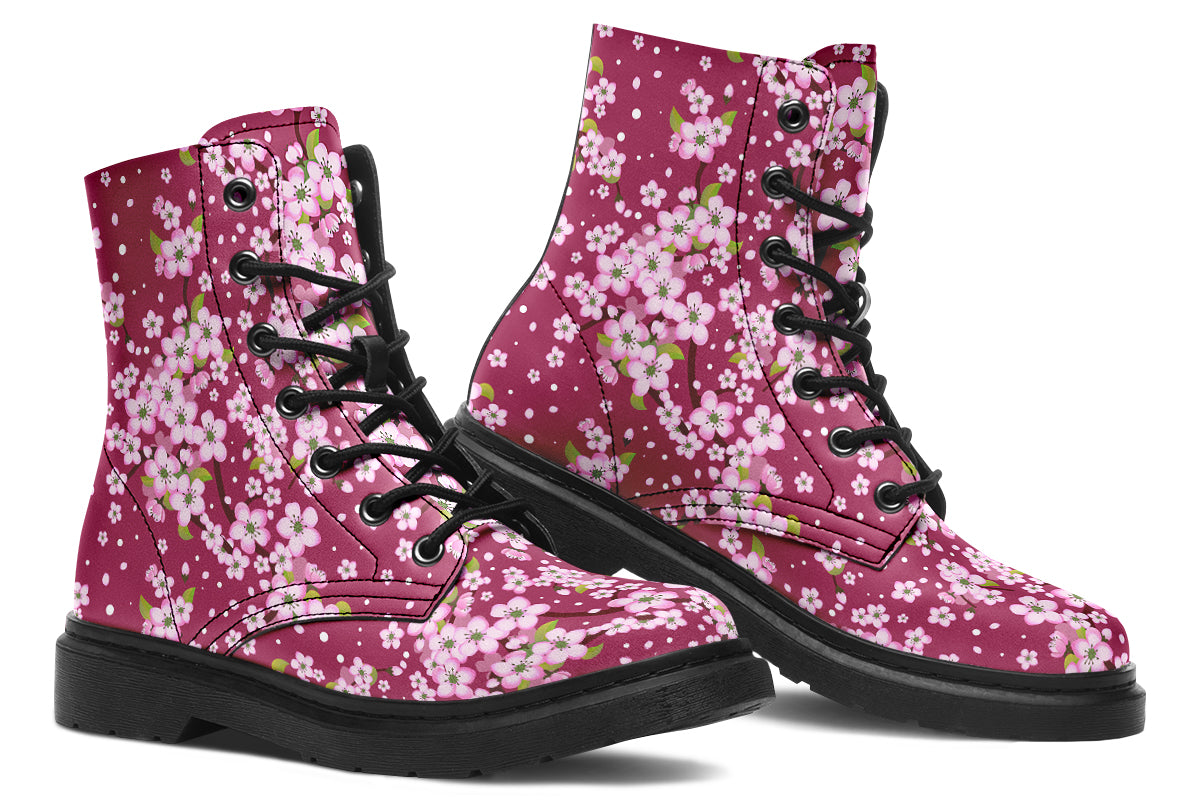Boots featuring a pink and white floral pattern on a dark reddish pink background