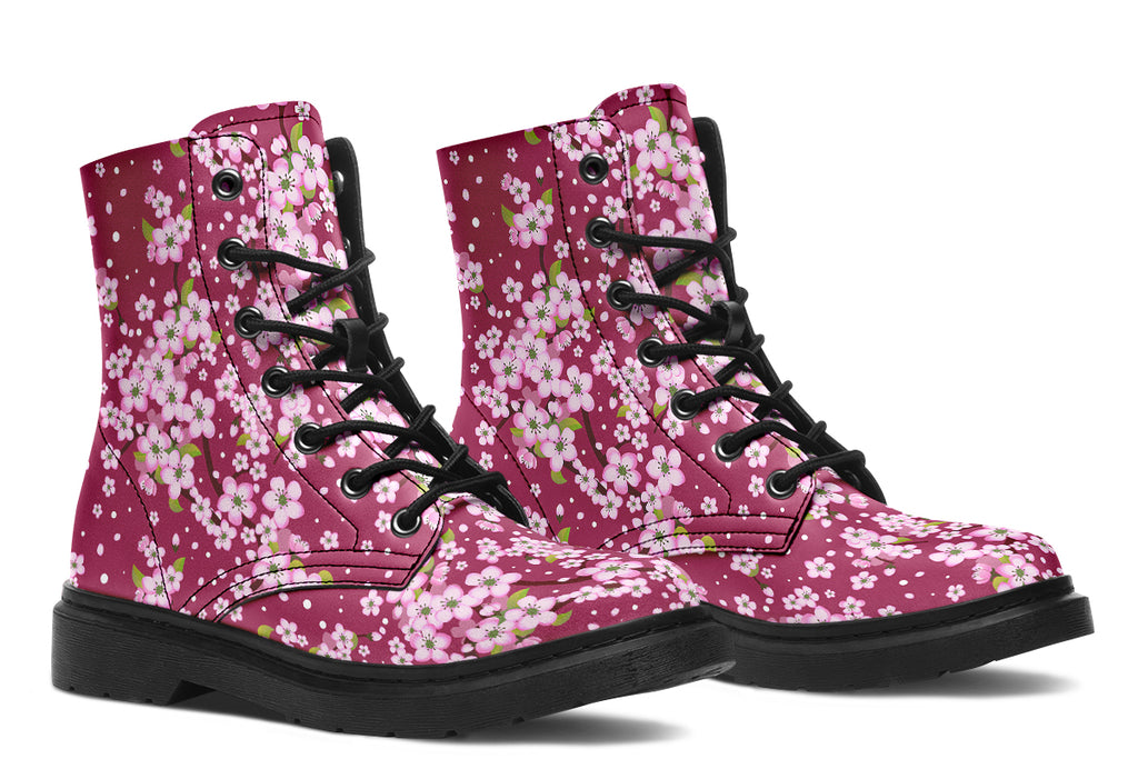 Boots featuring a pink and white floral pattern on a dark reddish pink background