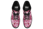 Boots featuring a pink and white floral pattern on a dark reddish pink background