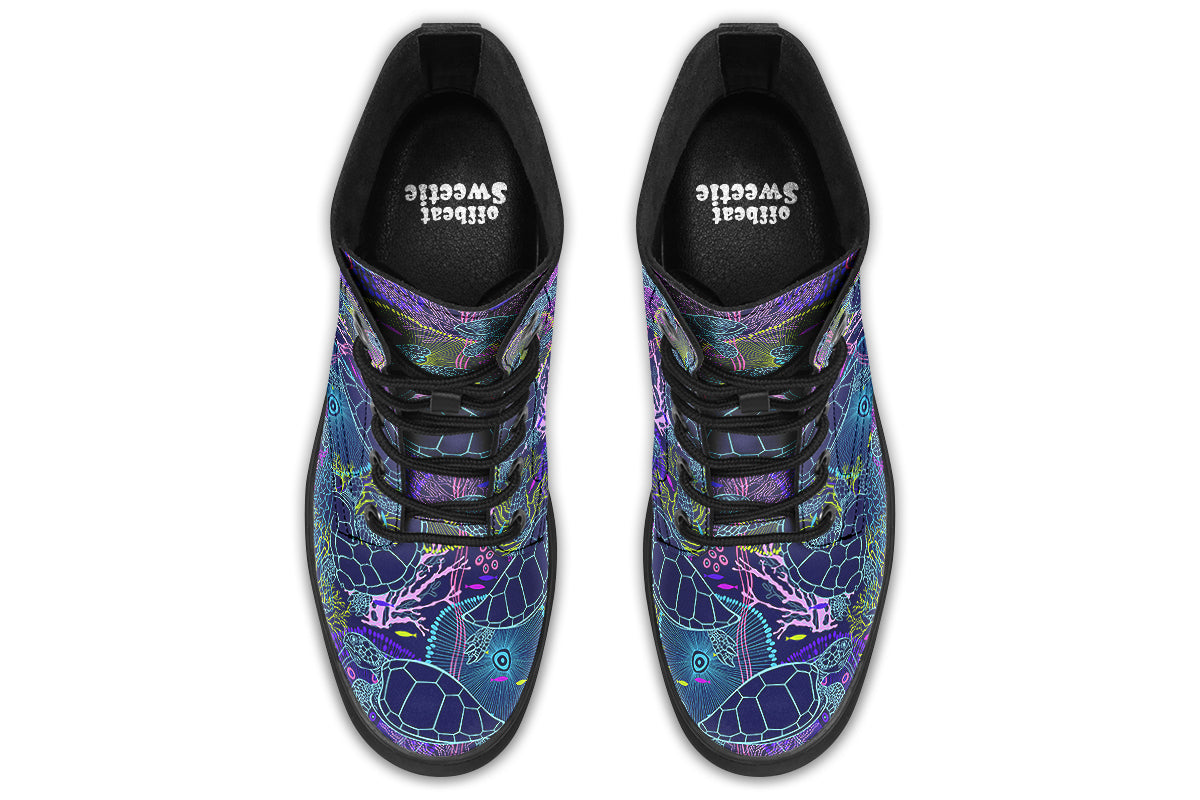 Boots with a black sole and sea-turtle themed design in hues of blues and purples.