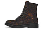 Very dark brown boots with bronze spiderweb patterns on them