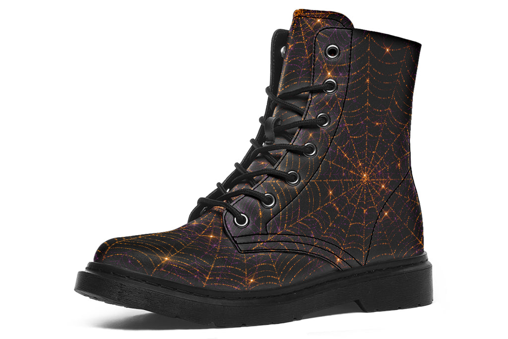 Very dark brown boots with bronze spiderweb patterns on them