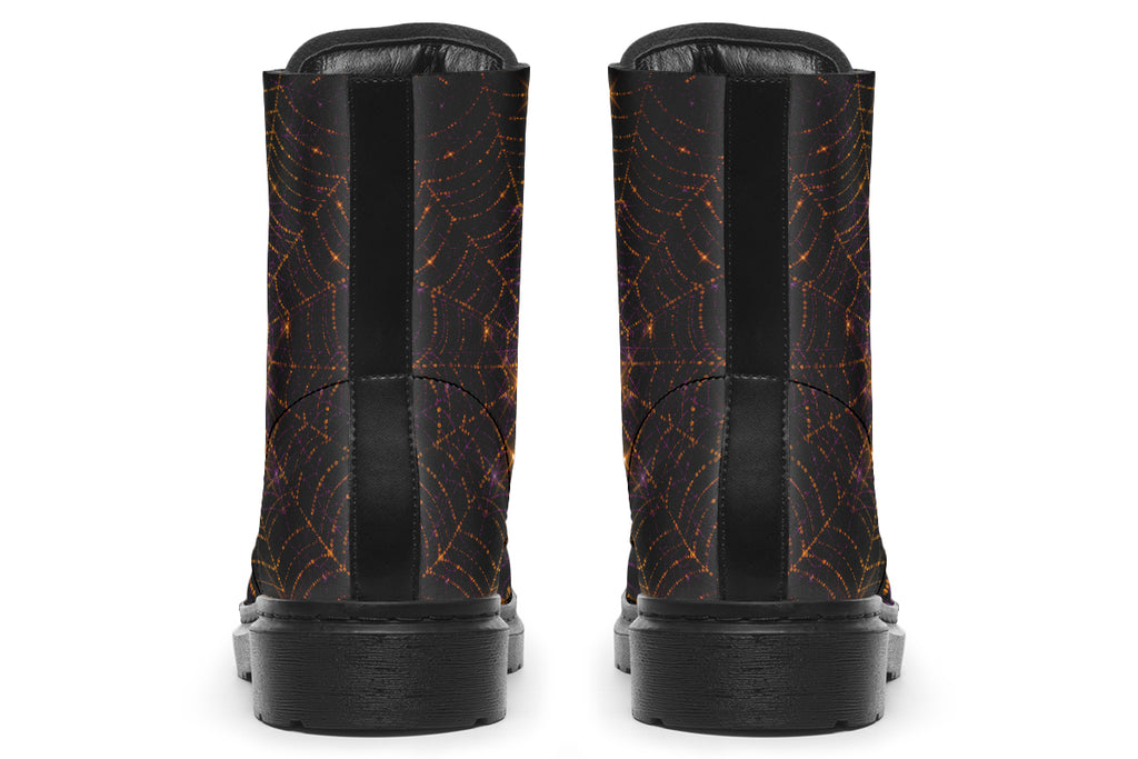 Very dark brown boots with bronze spiderweb patterns on them