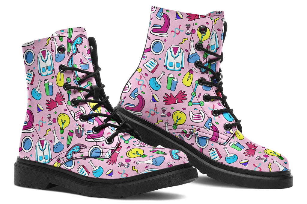 Pink boots featuring a pattern of various STEM icons, such as microscopes, lab coats, DNA helix, microscopes, gloves and beakers. 