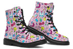 Pink boots featuring a pattern of various STEM icons, such as microscopes, lab coats, DNA helix, microscopes, gloves and beakers. 