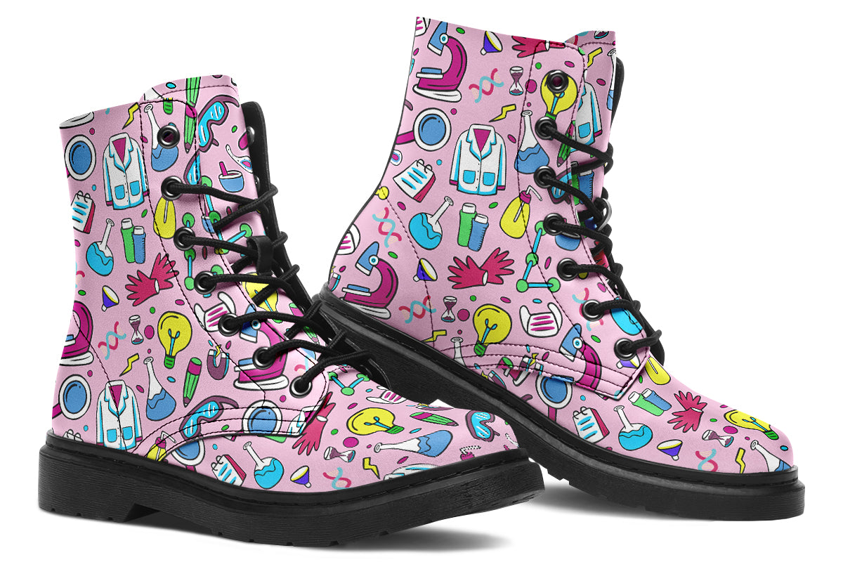 Pink boots featuring a pattern of various STEM icons, such as microscopes, lab coats, DNA helix, microscopes, gloves and beakers. 
